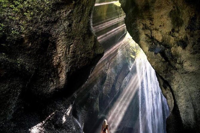 Bali Gate of Heaven and Hidden Waterfall privatel Tour - Tirta Gangga water palace: clear spring pools and fish-filled calm