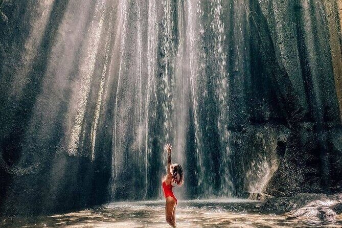 Discover the best waterfalls in Ubud and rice terraces tour - Tukad Cepung Waterfall: the hidden valley spot with sunlight shafts