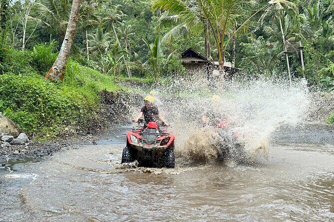 Full day Bali Adventure with Quad Bike and River Tubing - Quad biking in Ubud: bamboo, orange, mud, water, and a cave