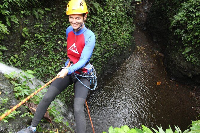 Fun Canyoning in Gitgit Canyon - Entering the gorge: training becomes real with jumps, slides, abseils, and caves