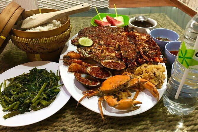 Romantic Seafood Dinner at Jimbaran Beach Bali include Sunset - The live seafood dining scene: why it makes choosing easier