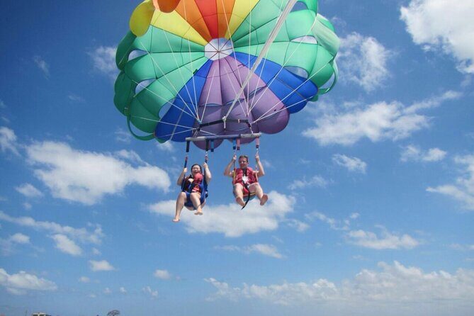 South Bali Tour: Watersport, GWK, Uluwatu Sunset, and Kecak Dance - Stop 1: Tanjung Benoa Beach water sports (jetski, banana boat, parasailing)